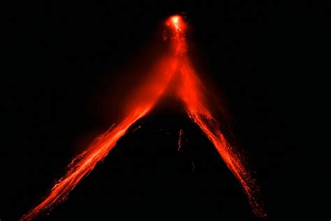 Philippines’ Mayon Volcano spews lava down its slopes in gentle eruption putting thousands on alert
